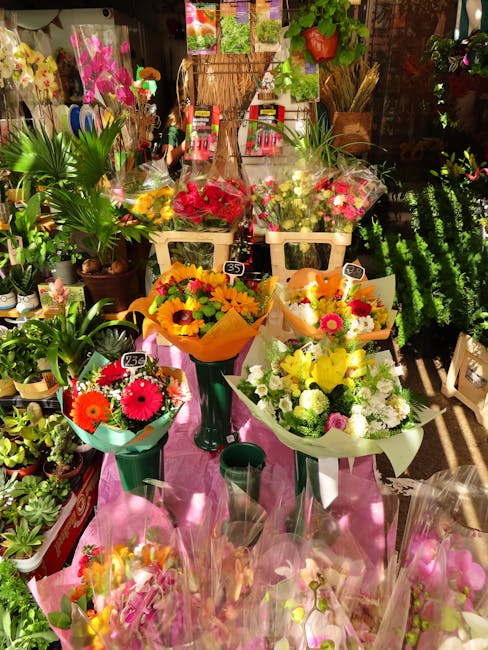 A vibrant display of freshly arranged bouquets and floral gifts at Flowers Blackwall, showcasing a variety of colorful flowers including pink, yellow, orange, and white blooms, wrapped in decorative p